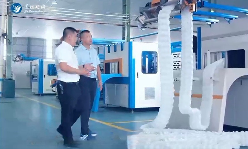 Technicians working on spring coiling innovation